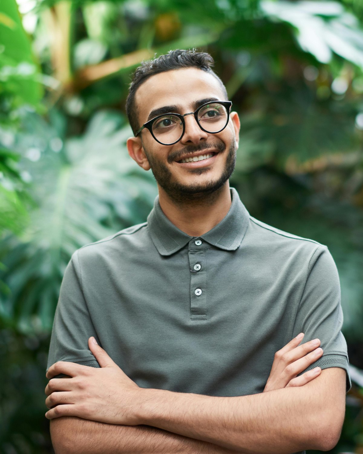 Jake, the landscaping company owner, smiling confidently in a garden setting